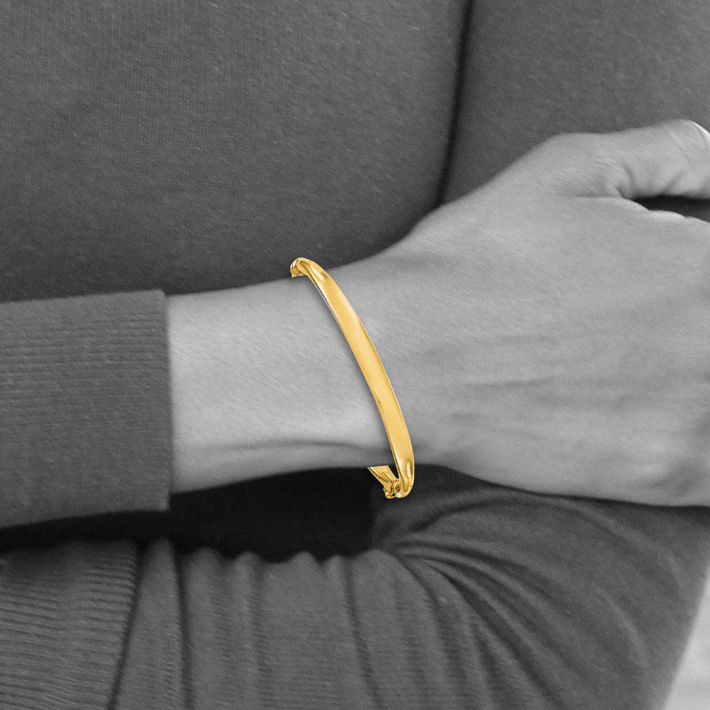 Alternate view of the 5.6mm 14k Yellow Gold Polished Hinged Bangle Bracelet by The Black Bow Jewelry Co.