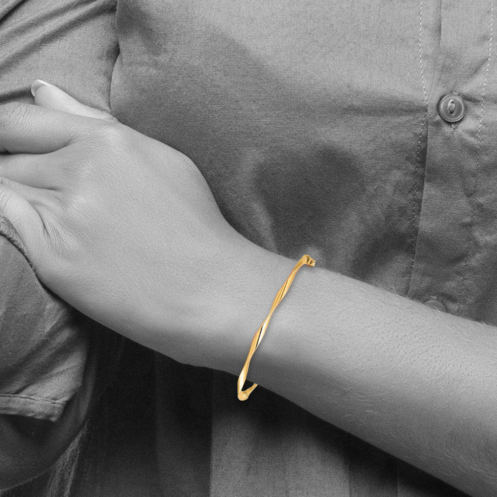 Alternate view of the 3mm 10k Yellow Gold Polished Twisted Hinged Bangle Bracelet by The Black Bow Jewelry Co.