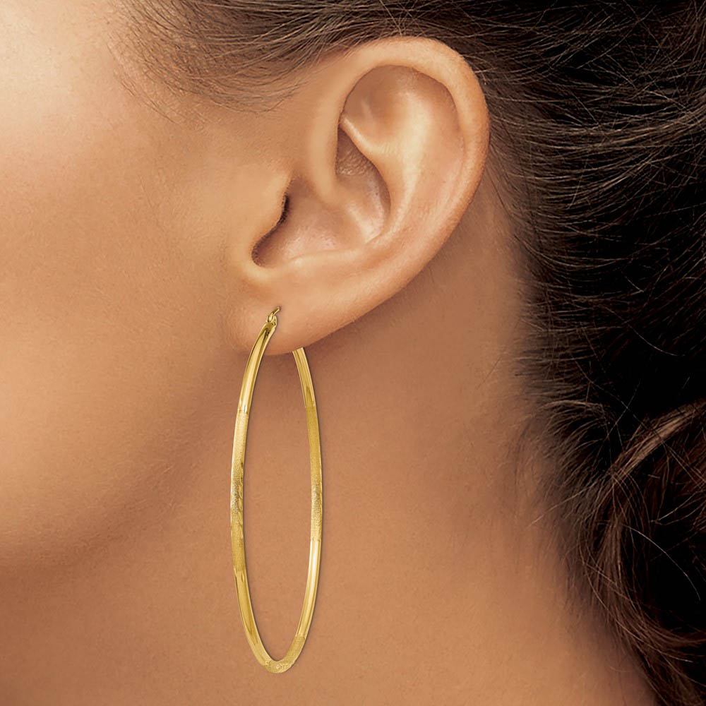 Alternate view of the 2mm x 60mm 14k Yellow Gold Satin & Diamond-Cut Round Hoop Earrings by The Black Bow Jewelry Co.
