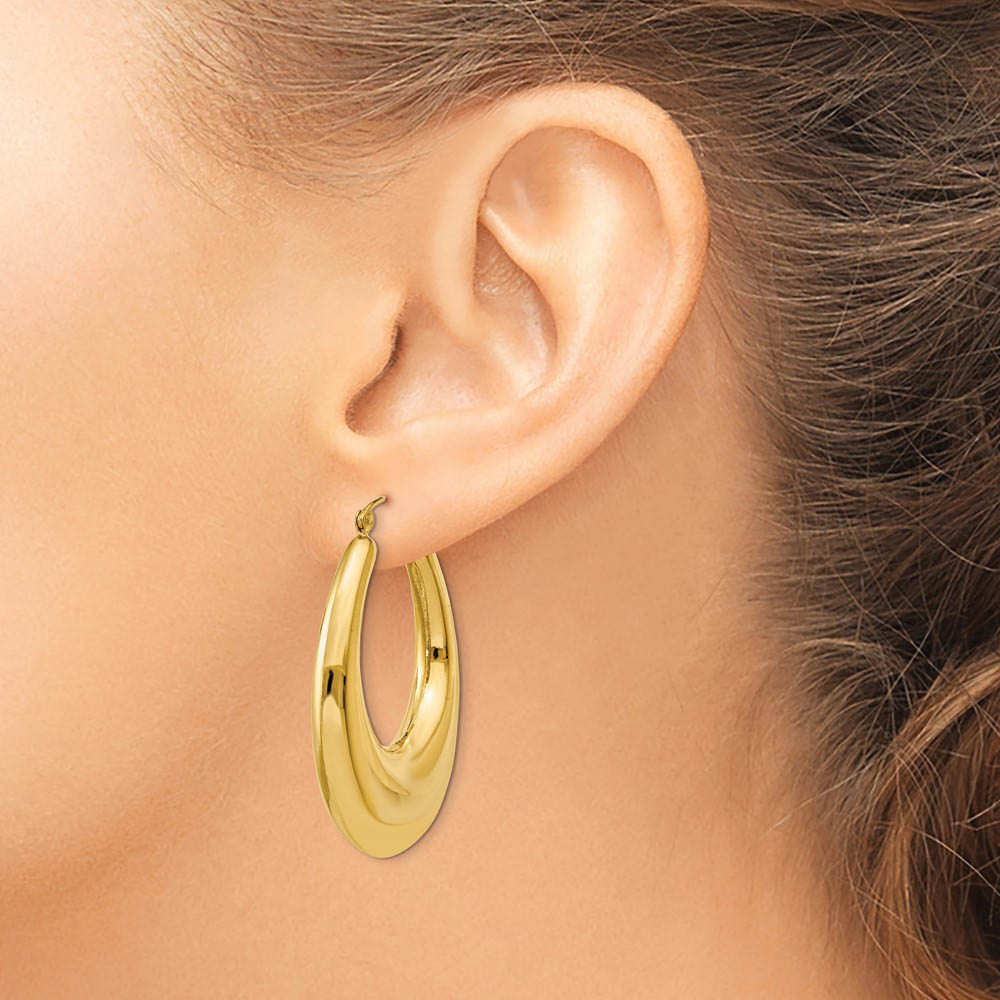 Alternate view of the 7mm x 40mm Polished 14k Yellow Gold Tapered Puffed Oval Hoop Earrings by The Black Bow Jewelry Co.