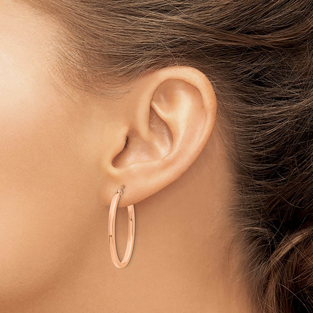 Alternate view of the 2mm x 29mm 14k Rose Gold Square Tube Oval Hoop Earrings by The Black Bow Jewelry Co.
