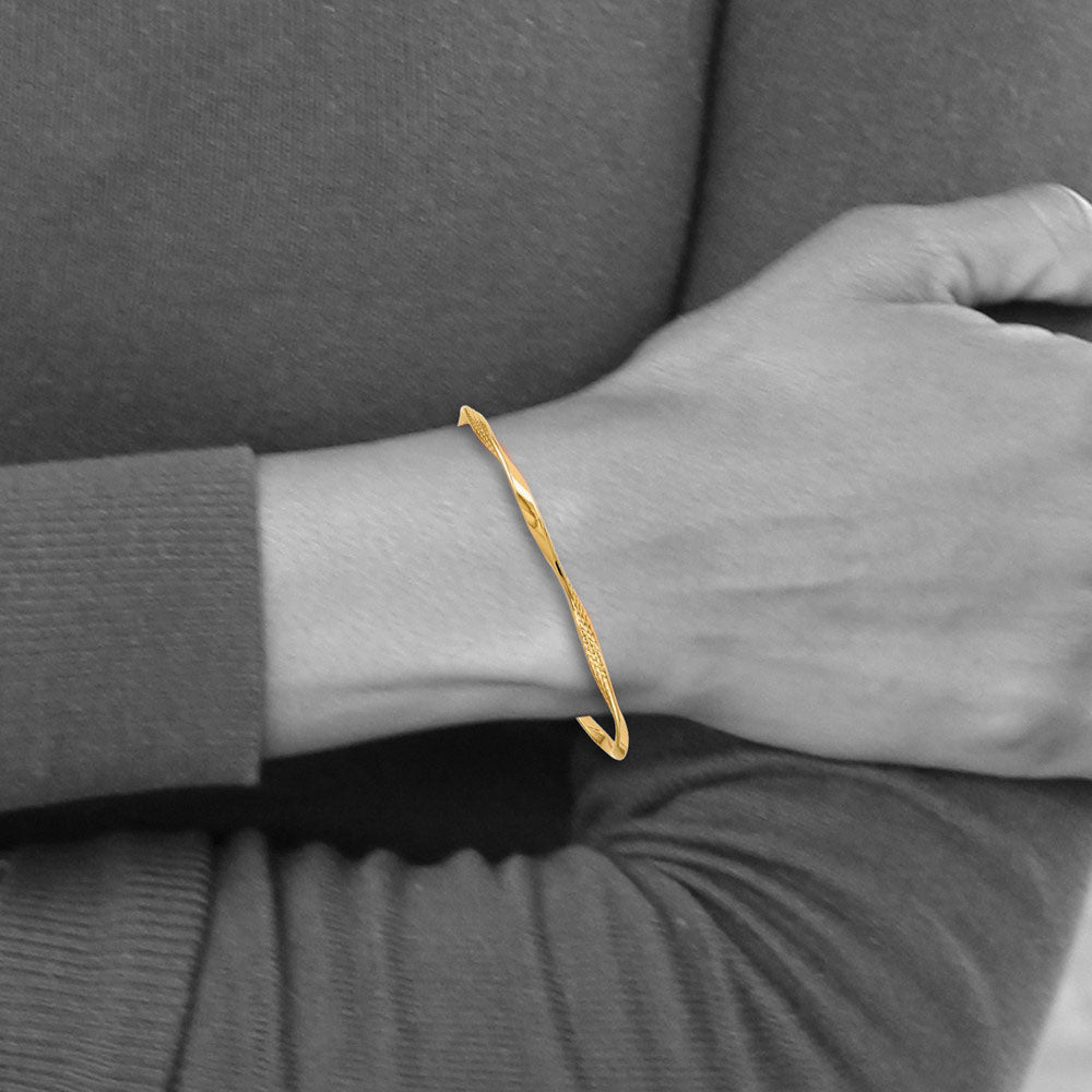 Alternate view of the 3mm 14k Yellow Gold Twisted Slip-on Bangle Bracelet by The Black Bow Jewelry Co.