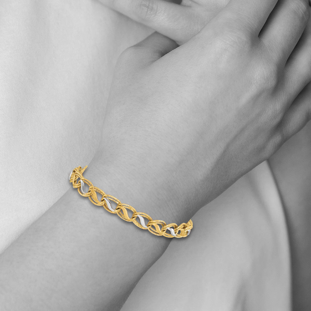 Alternate view of the 14k Two Tone Gold Textured and Polished Oval Link Bracelet, 7.5 Inch by The Black Bow Jewelry Co.
