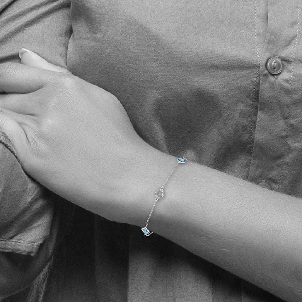 Alternate view of the Blue Topaz and Diamond Adj. Station Bracelet in Rhodium Plated Silver by The Black Bow Jewelry Co.