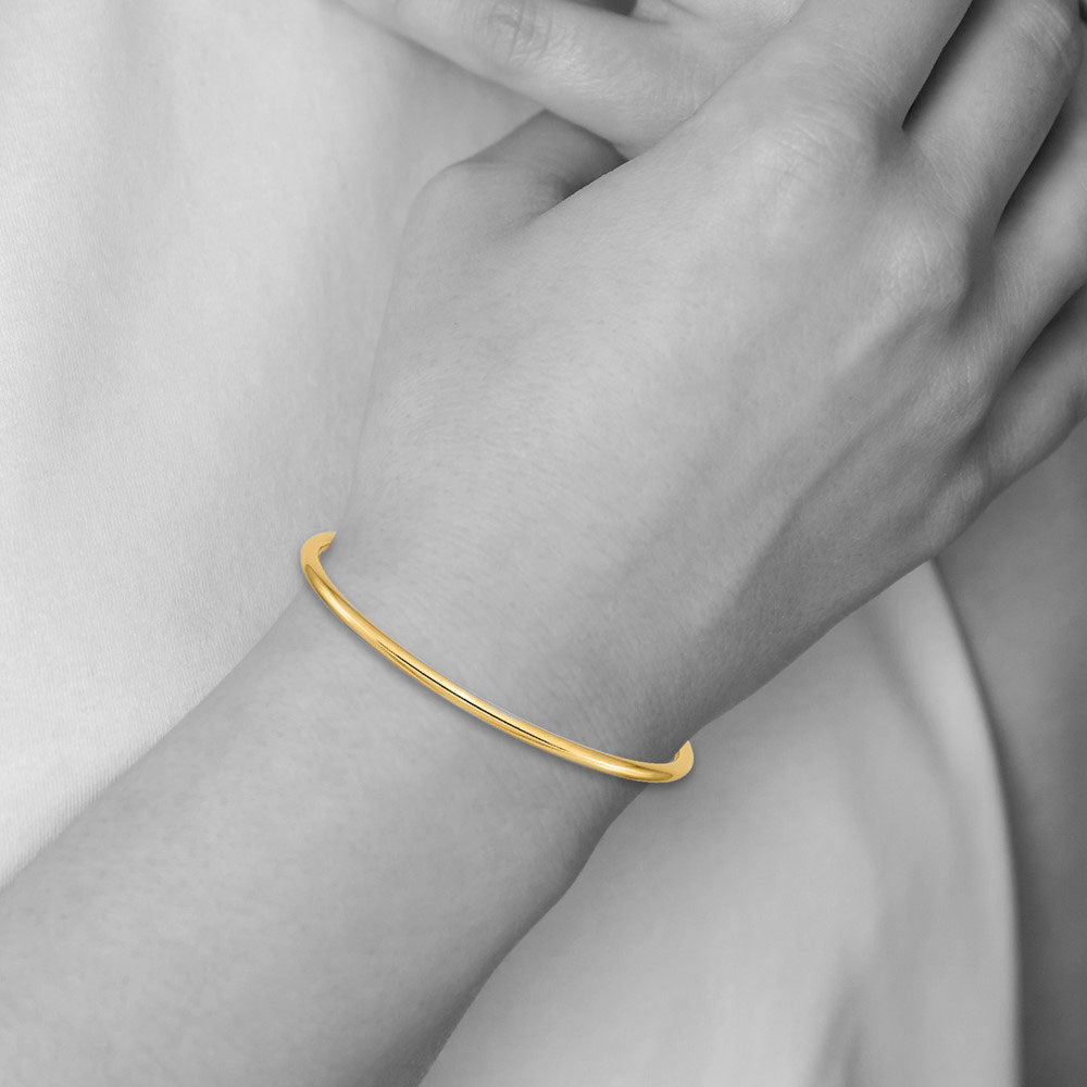 Alternate view of the 3mm 14k Yellow Gold Polished Hollow Round Tube Bangle Bracelet by The Black Bow Jewelry Co.