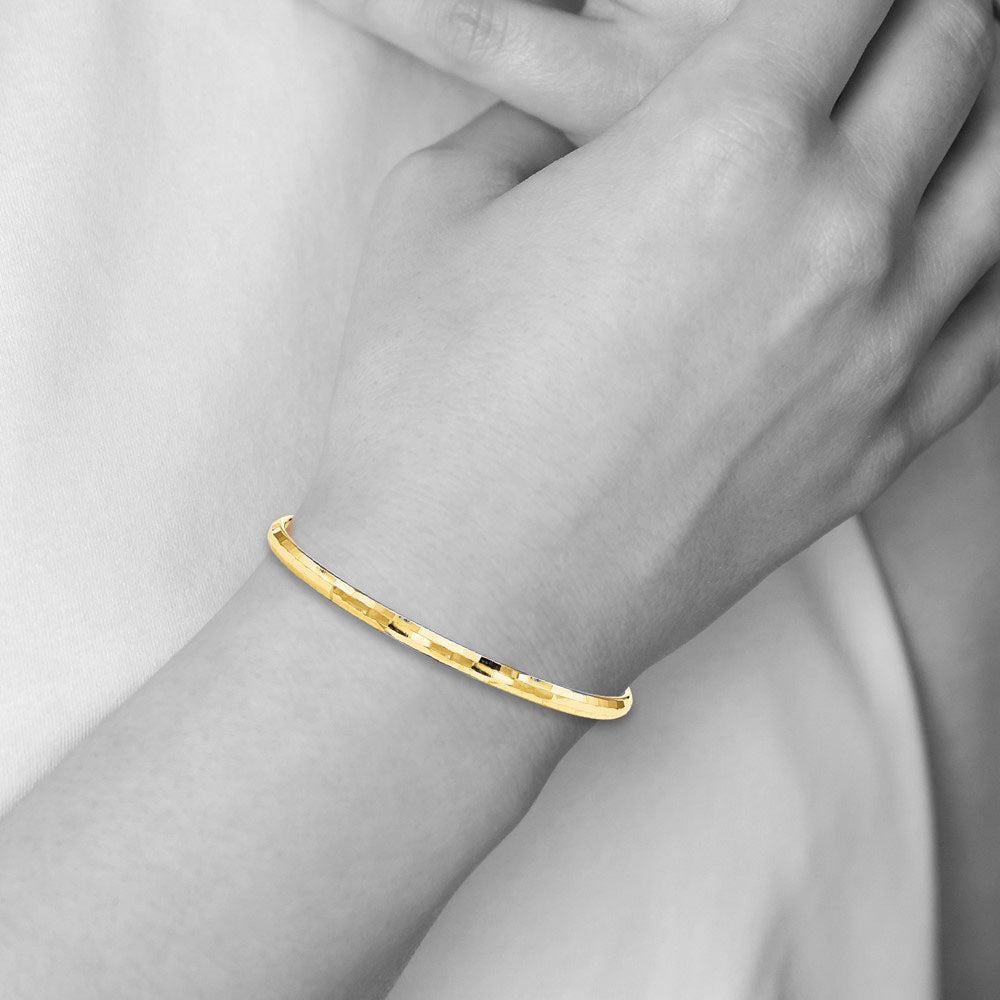 Alternate view of the 4.25mm 10k Yellow Gold Polished Faceted Slip-On Bangle Bracelet by The Black Bow Jewelry Co.