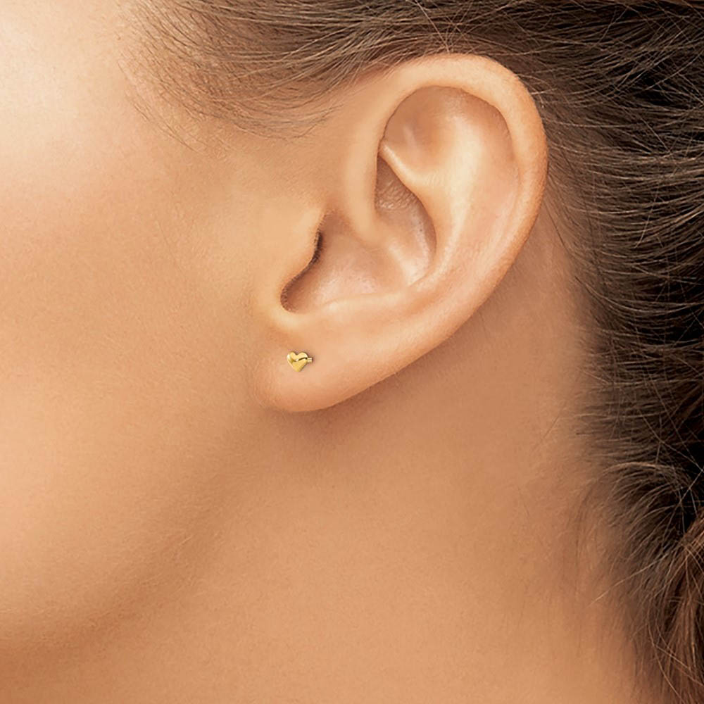 Alternate view of the Kids Tiny Polished Heart Screw Back Post Earrings in 14k Yellow Gold by The Black Bow Jewelry Co.