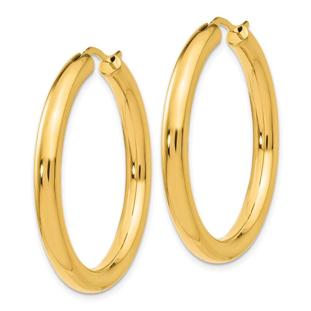 Alternate view of the 3.5mm Round Tube Hoop Earrings in Yellow Gold Tone Plated Silver, 33mm by The Black Bow Jewelry Co.