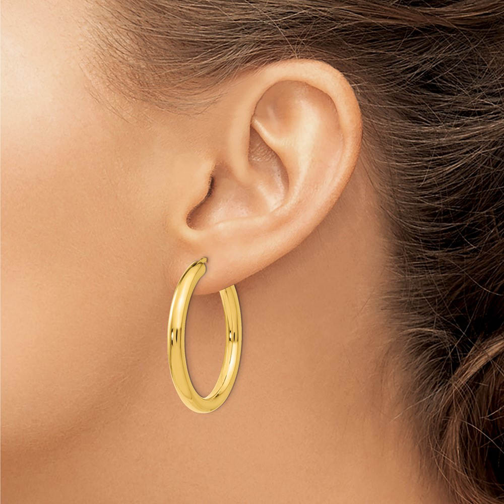 Alternate view of the 3.5mm Round Tube Hoop Earrings in Yellow Gold Tone Plated Silver, 33mm by The Black Bow Jewelry Co.
