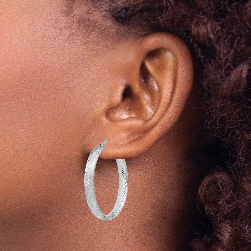 Alternate view of the 4mm Diamond-Cut Sterling Silver Round Hoop Earrings, 30mm (1 1/8 in) by The Black Bow Jewelry Co.