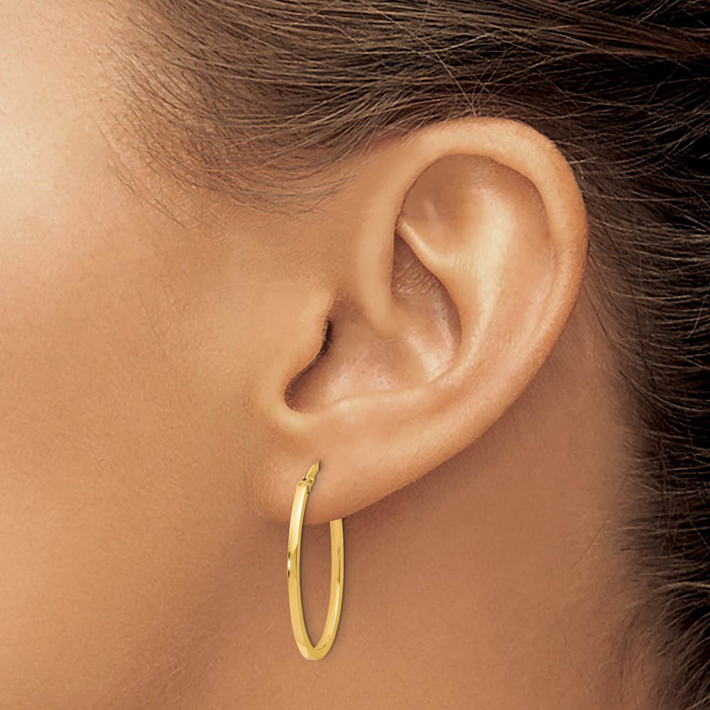 Alternate view of the 1.5mm Square Tube Oval Hoop Earrings in 14k Yellow Gold, 26mm (1 Inch) by The Black Bow Jewelry Co.