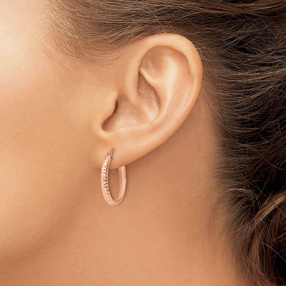 Alternate view of the 3.5mm 10k Rose Gold Diamond Cut Oval Hoop Earrings, 22mm (7/8 Inch) by The Black Bow Jewelry Co.