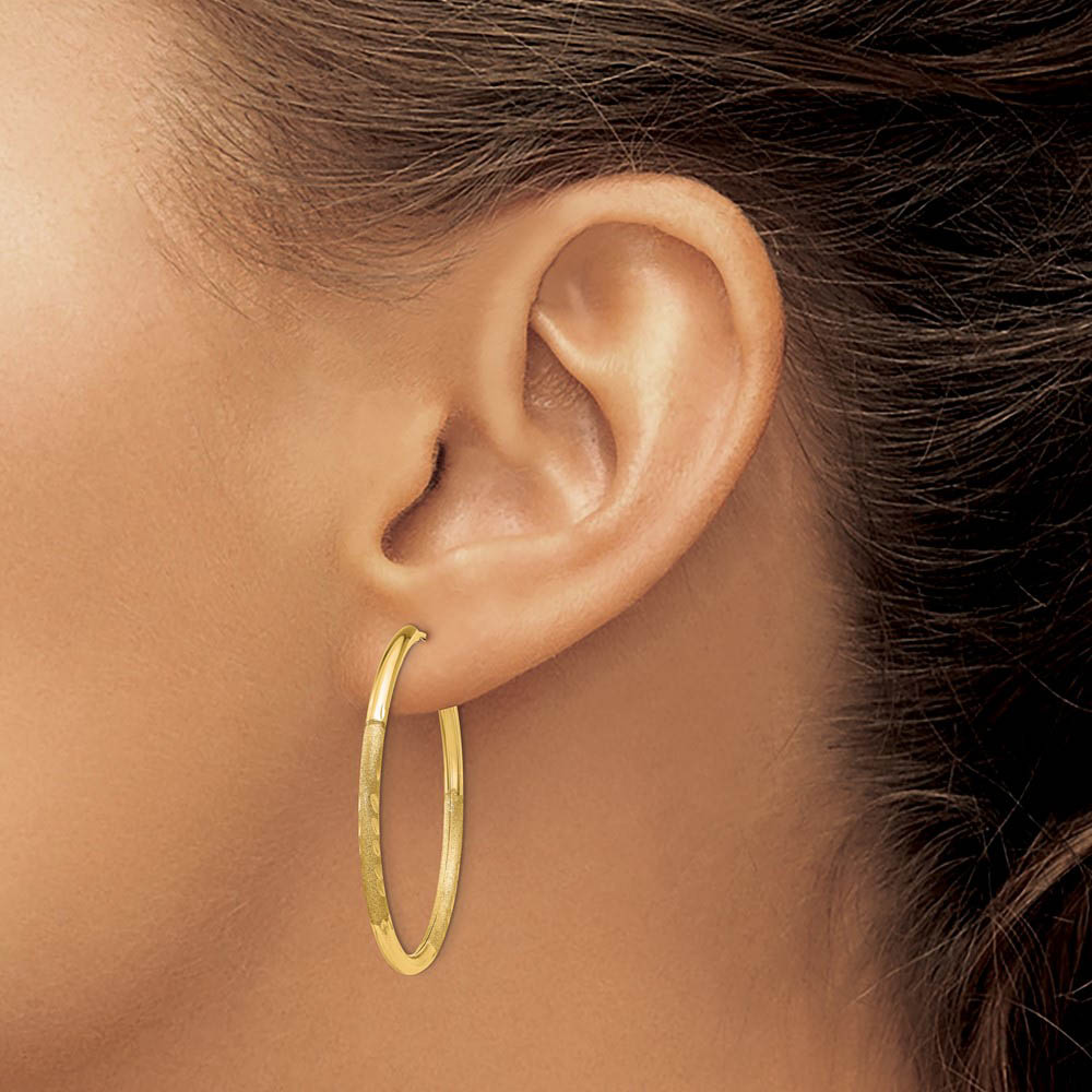 Alternate view of the 2mm x 34mm 14k Yellow Gold Satin Diamond-Cut Endless Hoop Earrings by The Black Bow Jewelry Co.