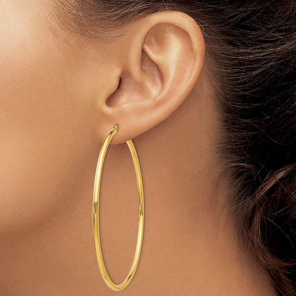 Alternate view of the 2.25mm x 70mm 14k Yellow Gold Polished Round Hoop Earrings by The Black Bow Jewelry Co.