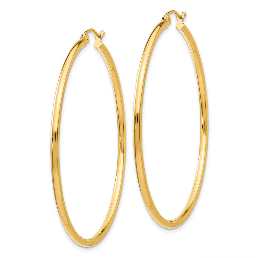 Alternate view of the 2mm x 50mm 14k Yellow Gold Classic Round Hoop Earrings by The Black Bow Jewelry Co.