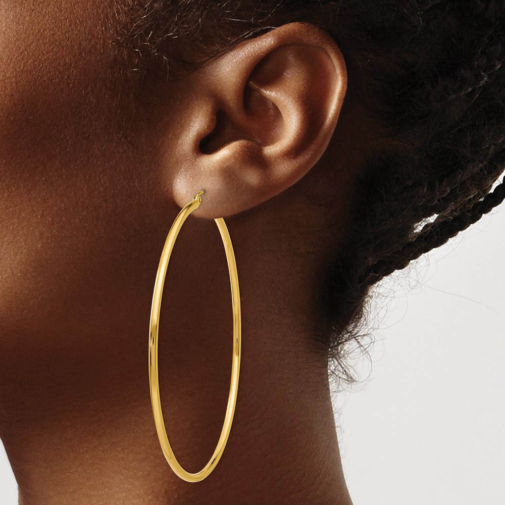 Alternate view of the 2mm x 65mm 14k Yellow Gold Classic Round Hoop Earrings by The Black Bow Jewelry Co.