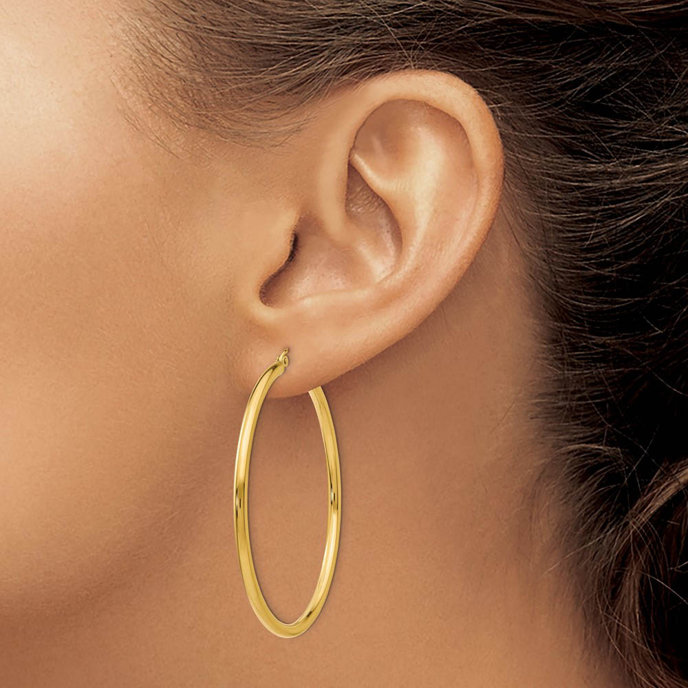 Alternate view of the 2.5mm x 50mm 14k Yellow Gold Classic Round Hoop Earrings by The Black Bow Jewelry Co.