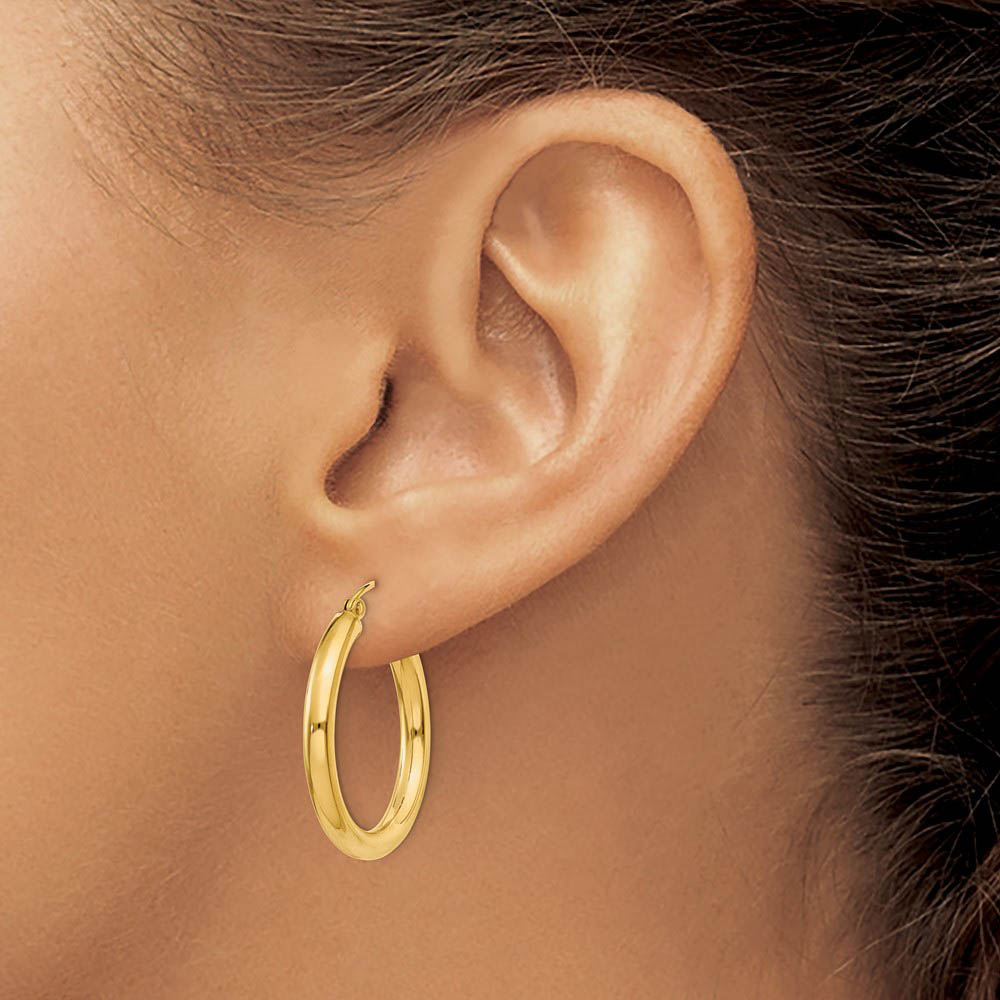 Alternate view of the 3mm x 25mm 14k Yellow Gold Classic Round Hoop Earrings by The Black Bow Jewelry Co.