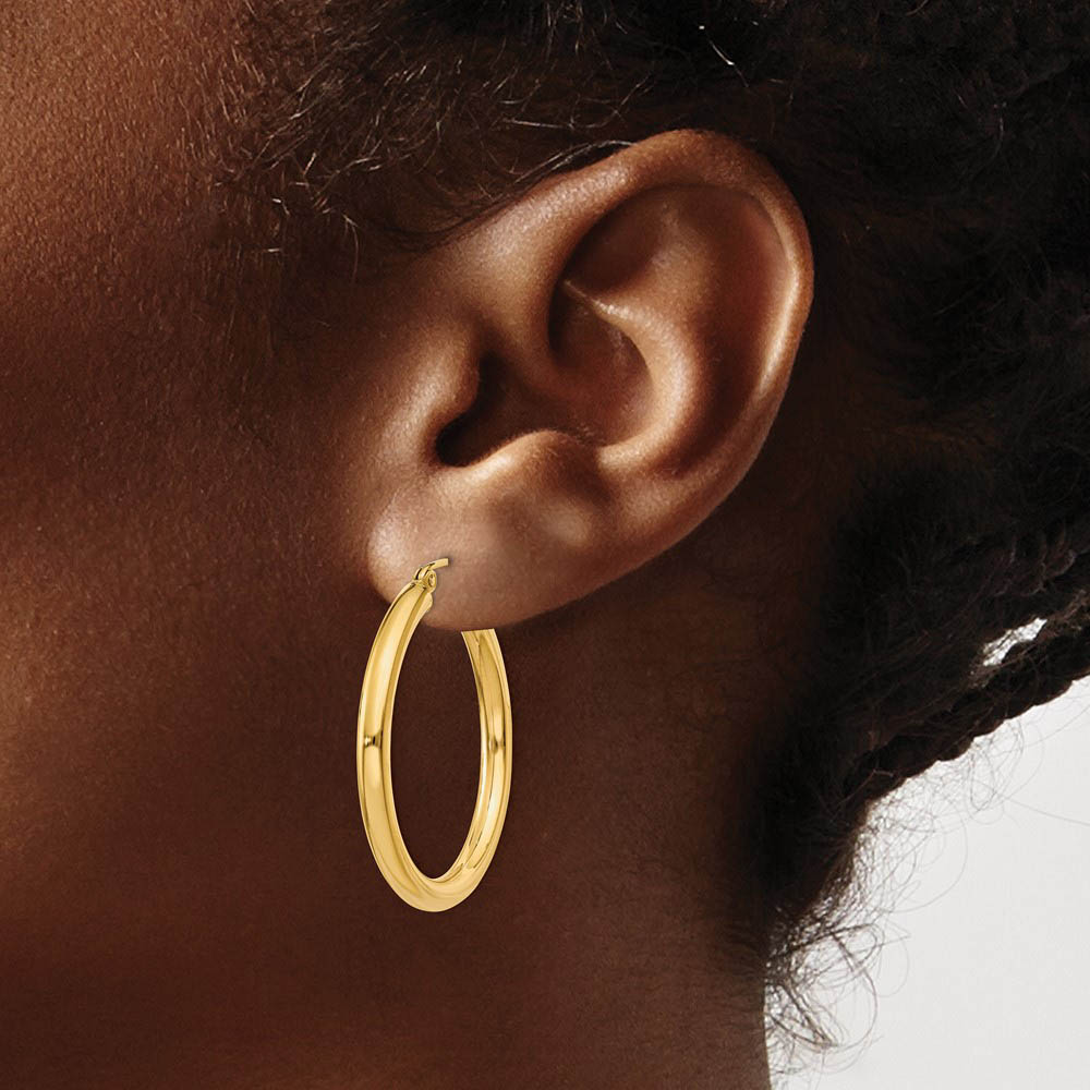 Alternate view of the 3mm x 30mm 14k Yellow Gold Classic Round Hoop Earrings by The Black Bow Jewelry Co.