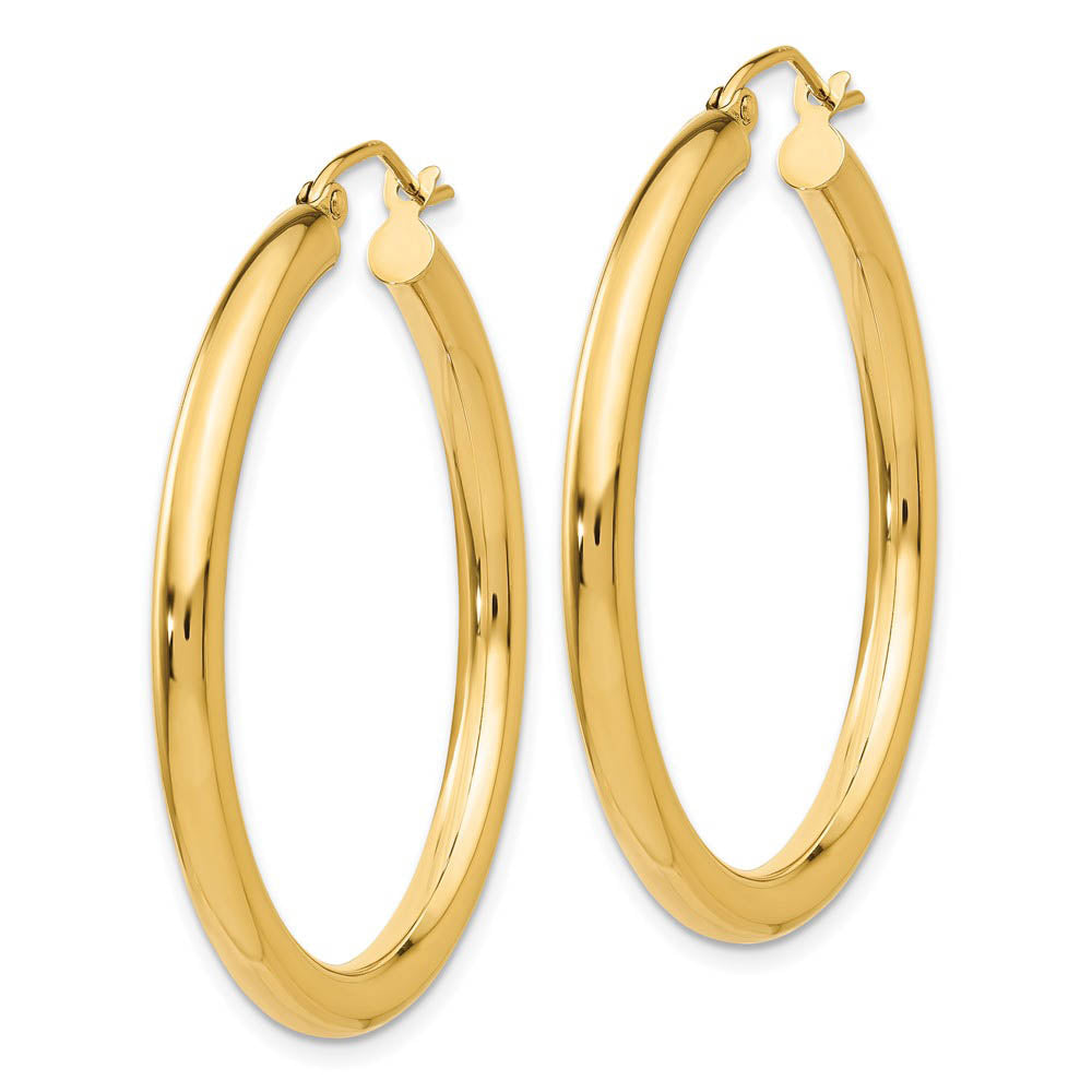 Alternate view of the 3mm x 35mm 14k Yellow Gold Classic Round Hoop Earrings by The Black Bow Jewelry Co.