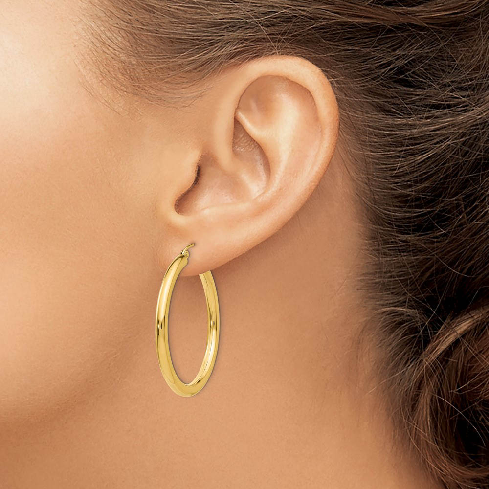 Alternate view of the 3mm x 35mm 14k Yellow Gold Classic Round Hoop Earrings by The Black Bow Jewelry Co.