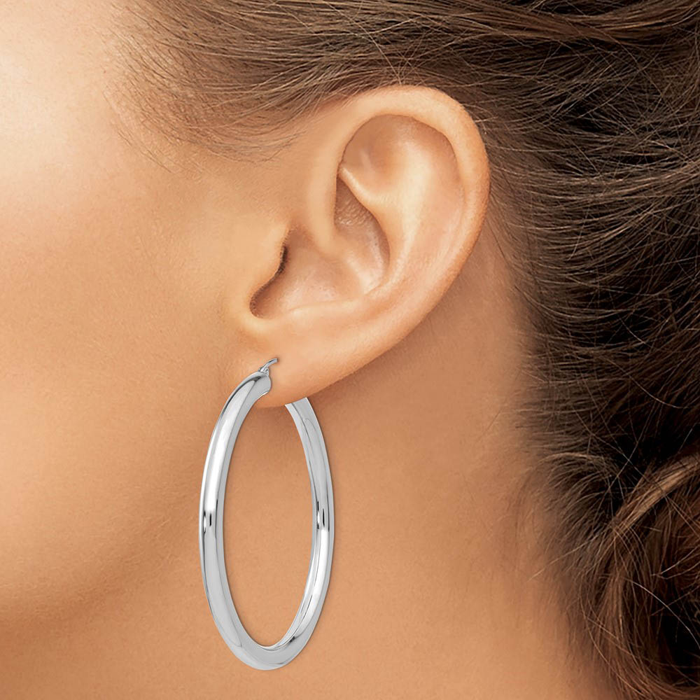 Alternate view of the 4mm x 50mm 14k White Gold Classic Round Hoop Earrings by The Black Bow Jewelry Co.