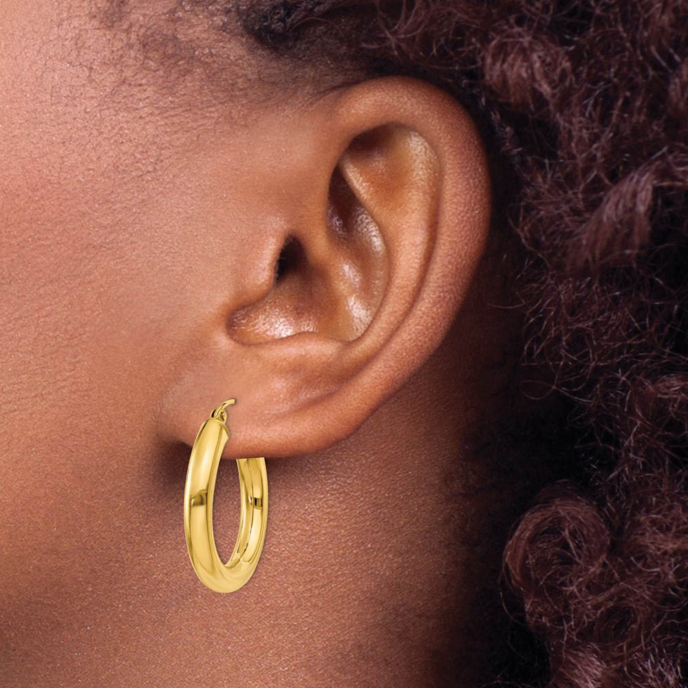 Alternate view of the 4mm x 25mm 14k Yellow Gold Classic Round Hoop Earrings by The Black Bow Jewelry Co.