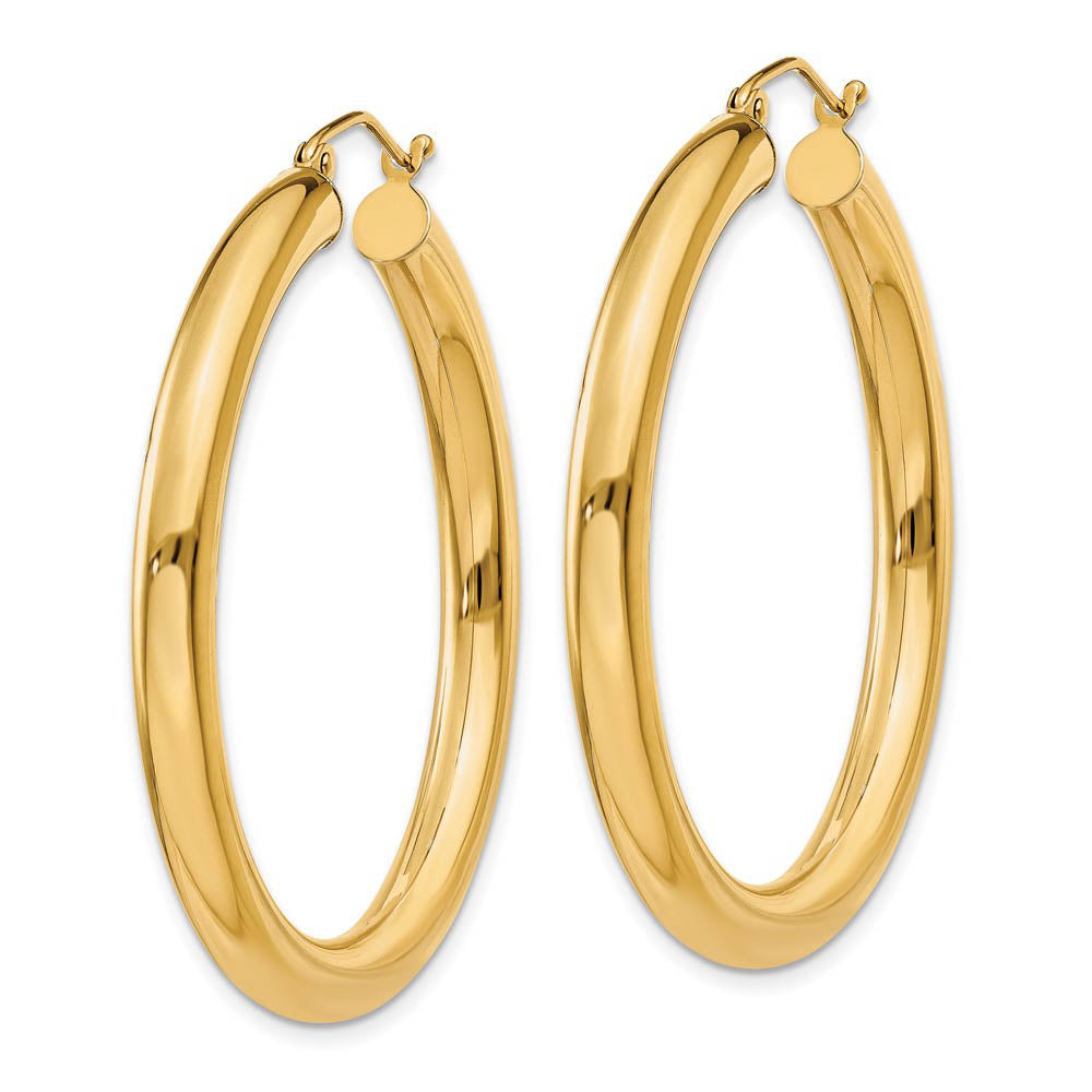 Alternate view of the 4mm x 40mm 14k Yellow Gold Classic Round Hoop Earrings by The Black Bow Jewelry Co.