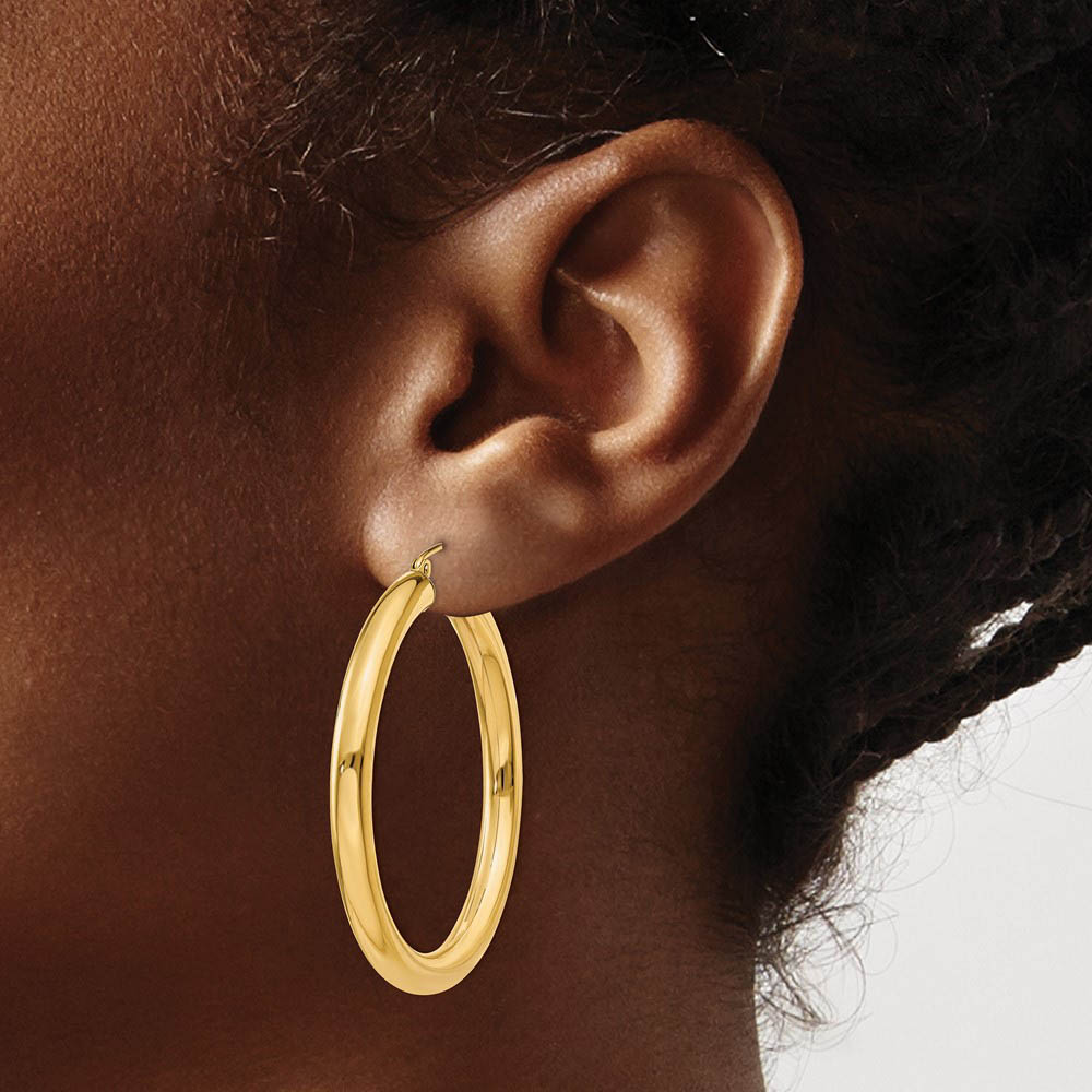 Alternate view of the 4mm x 40mm 14k Yellow Gold Classic Round Hoop Earrings by The Black Bow Jewelry Co.