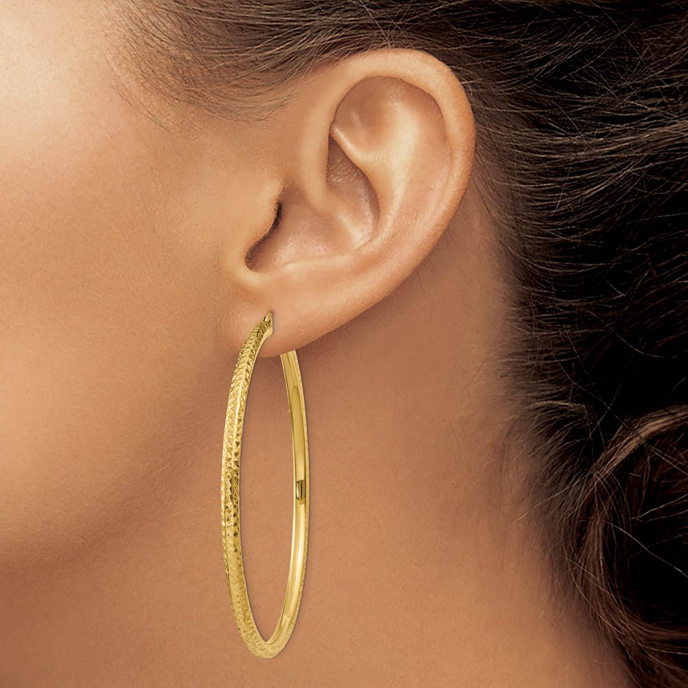 Alternate view of the 3mm x 60mm, 14k Yellow Gold, Diamond-cut Round Hoop Earrings by The Black Bow Jewelry Co.