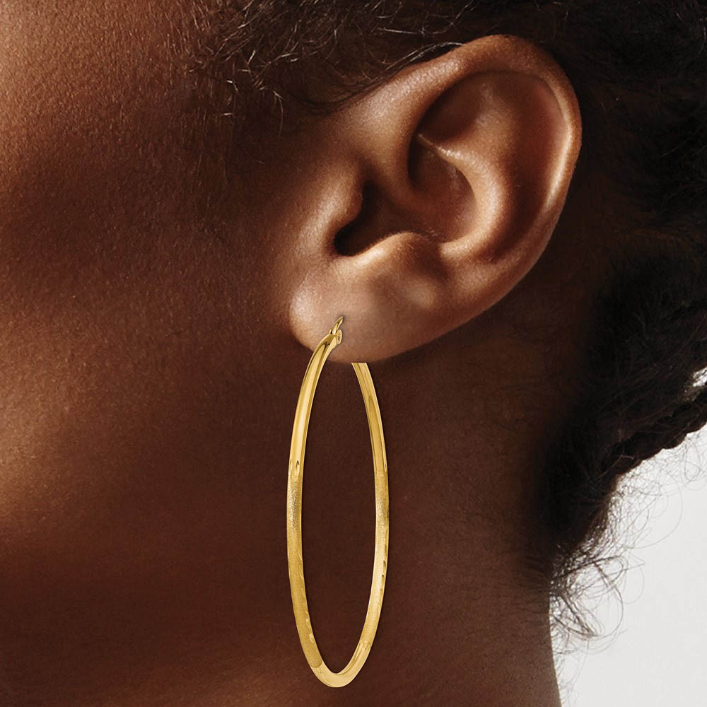 Alternate view of the 2mm x 50mm 14k Yellow Gold Satin & Diamond-Cut Round Hoop Earrings by The Black Bow Jewelry Co.