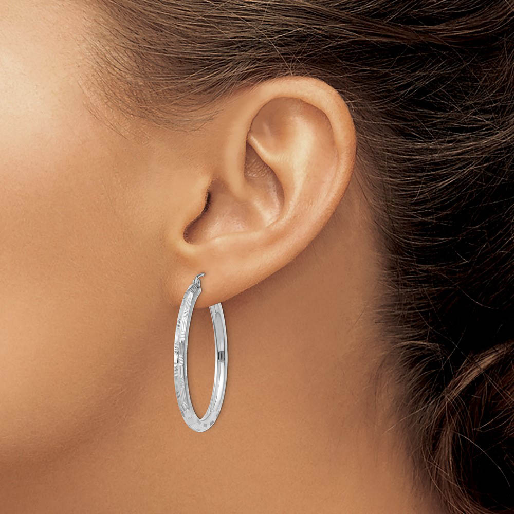 Alternate view of the 3mm x 35mm 14k White Gold Textured Round Hoop Earrings by The Black Bow Jewelry Co.