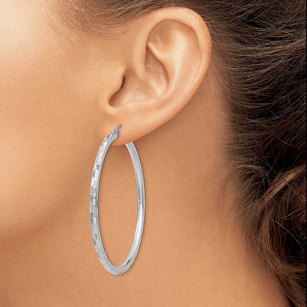 Alternate view of the 3mm x 45mm 14k White Gold Textured Round Hoop Earrings by The Black Bow Jewelry Co.