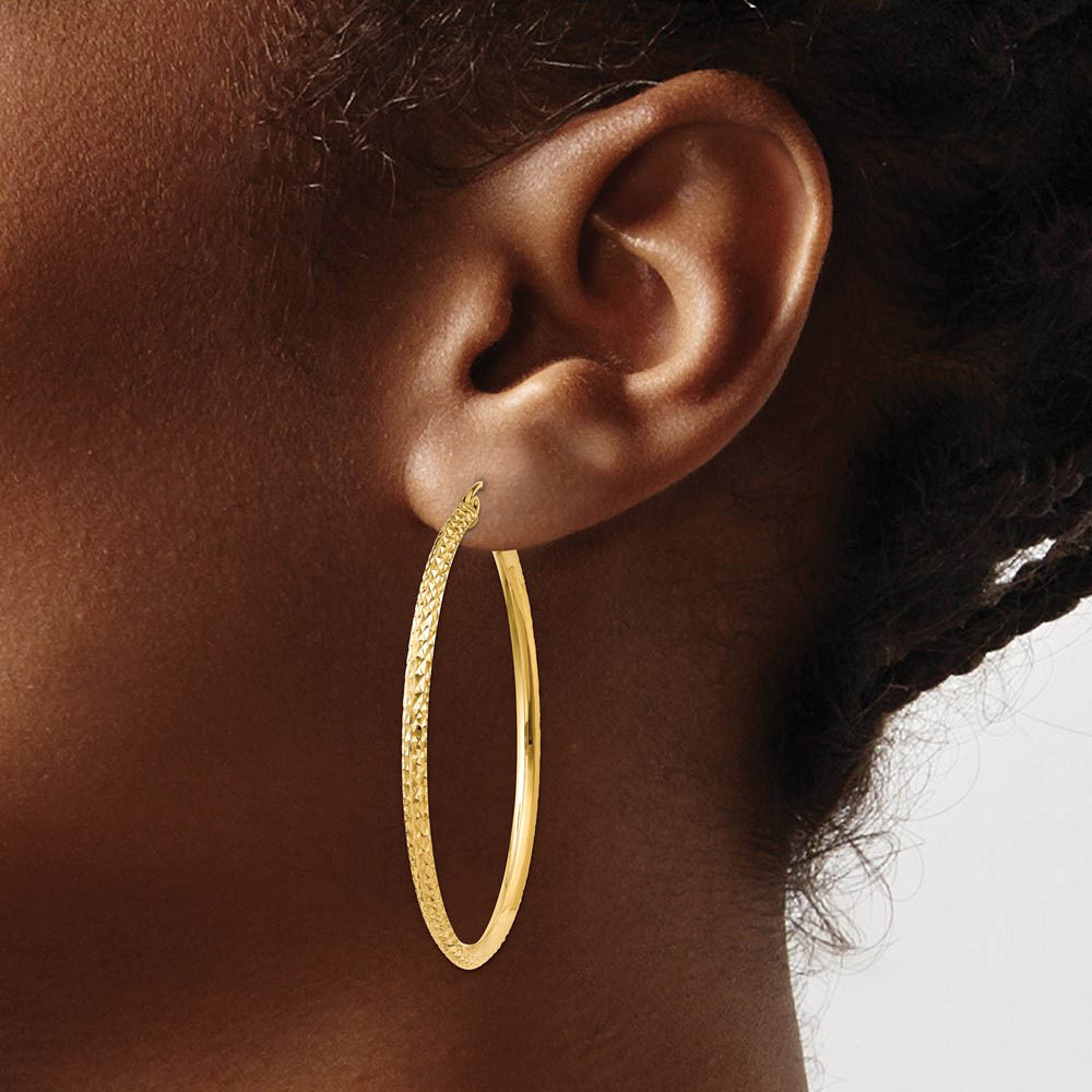 Alternate view of the 2.5mm x 45mm 14k Yellow Gold Knife Edge Diamond-Cut Round Hoops by The Black Bow Jewelry Co.