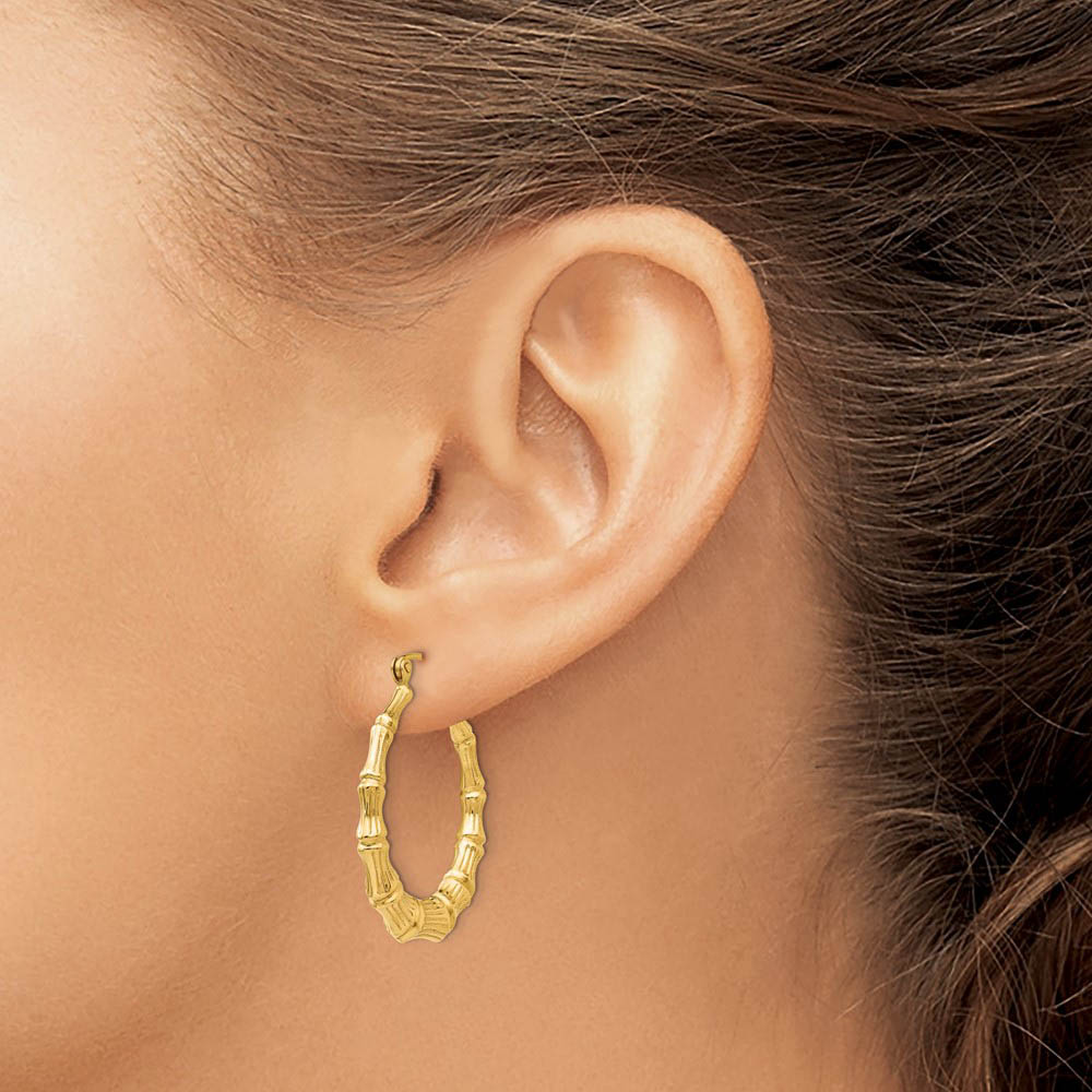 Alternate view of the 4mm x 26mm 14k Yellow Gold Hollow Bamboo Inspired Hoop Earrings by The Black Bow Jewelry Co.