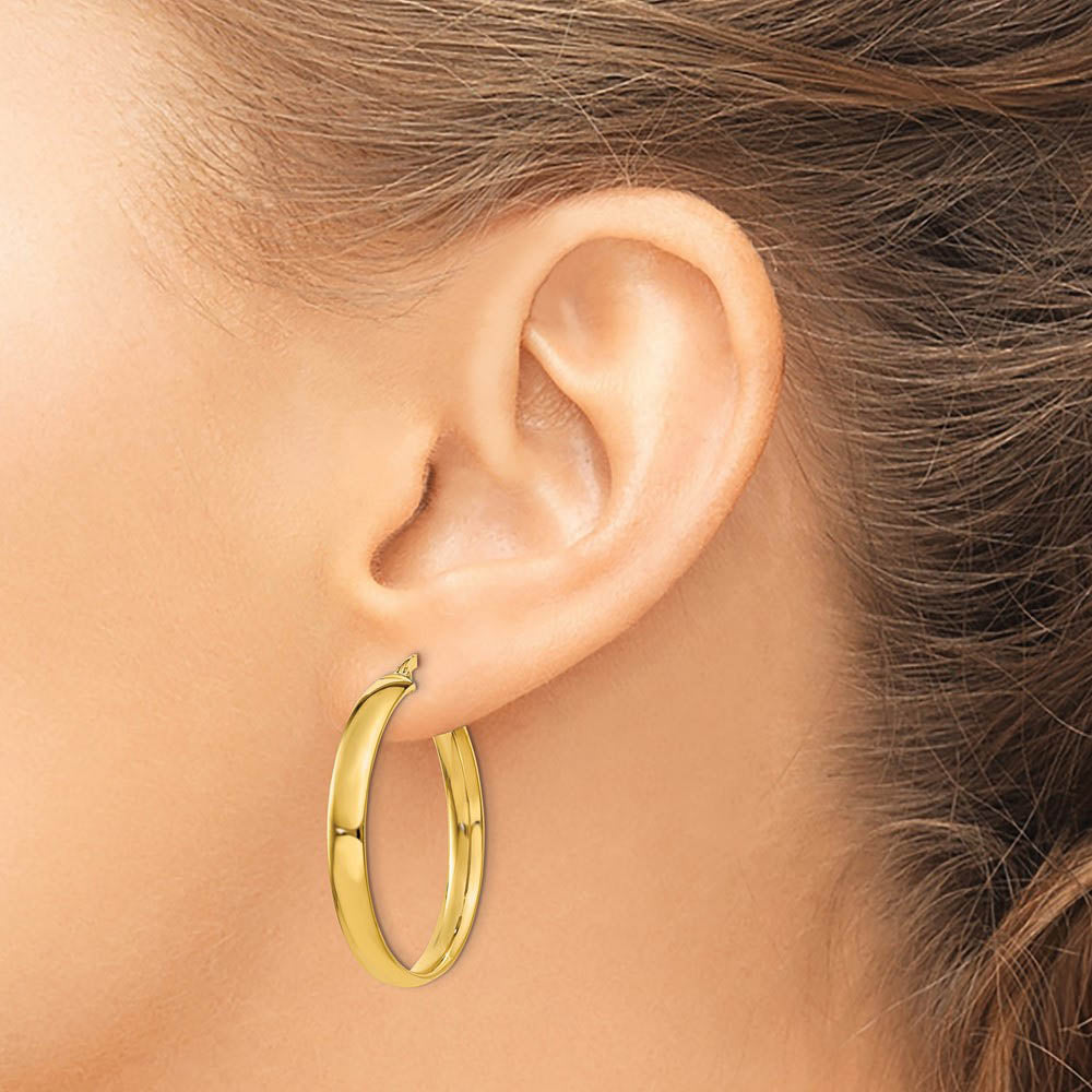 Alternate view of the 4mm x 28mm Polished 14k Yellow Gold Round Hoop Earrings by The Black Bow Jewelry Co.