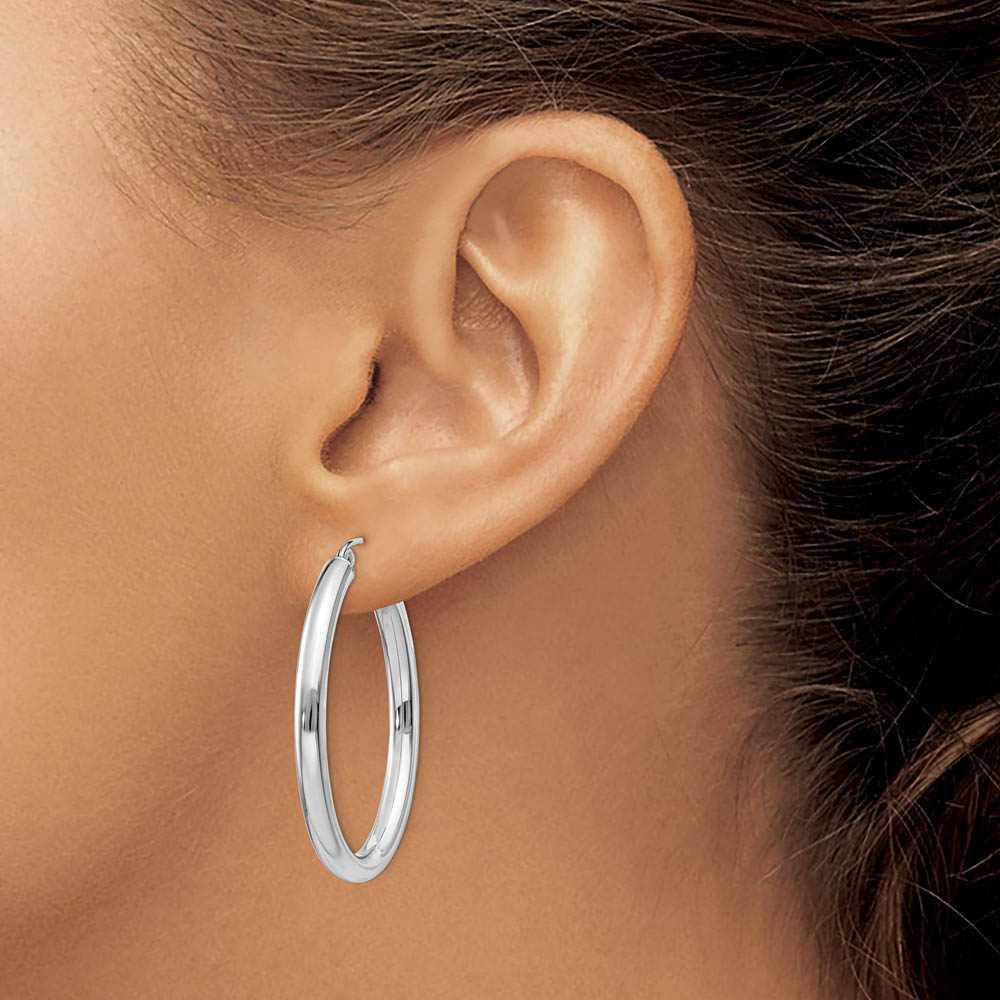 Alternate view of the 3.5mm x 38mm Polished 14k White Gold Classic Oval Tube Hoop Earrings by The Black Bow Jewelry Co.