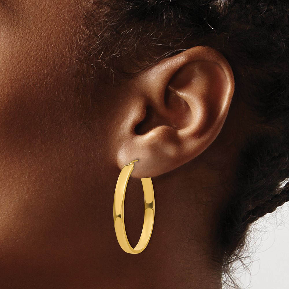 Alternate view of the 4mm x 35mm Polished 14k Yellow Gold Rectangular Tube Oval Hoops by The Black Bow Jewelry Co.