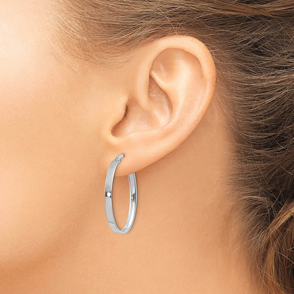 Alternate view of the 3mm x 29mm White Rhodium Plated 14k Yellow Gold Oval Hoop Earrings by The Black Bow Jewelry Co.