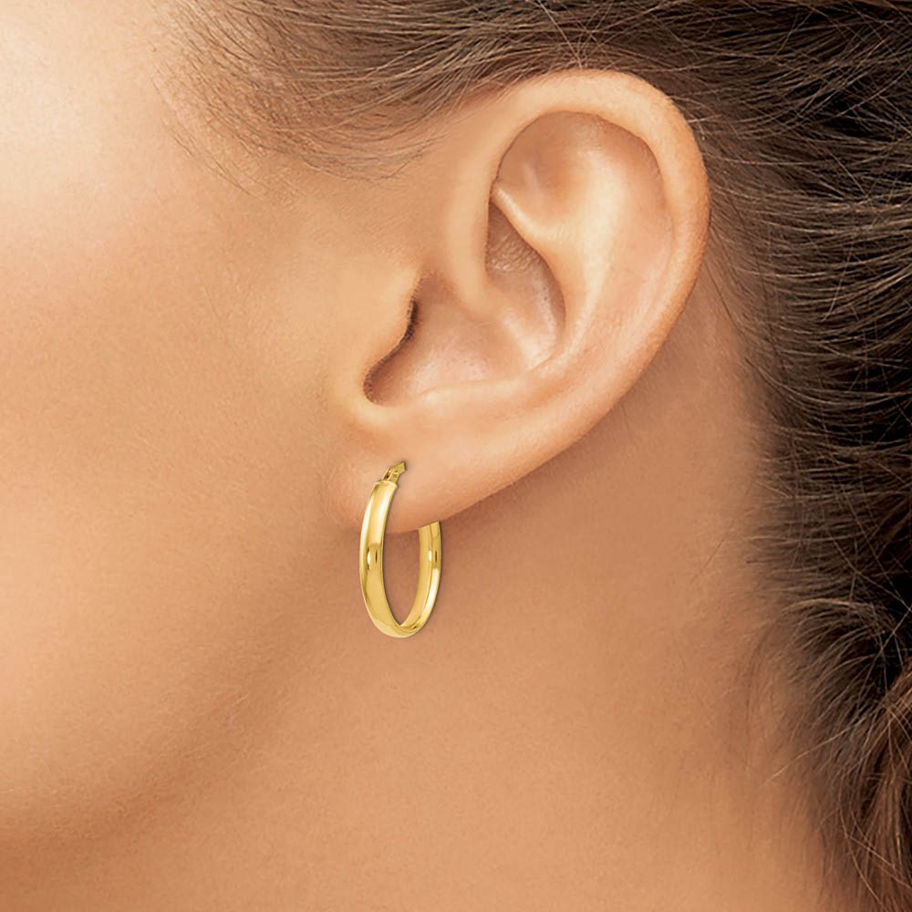 Alternate view of the 3mm x 22mm (7/8 Inch) Polished 14k Yellow Gold Oval Tube Hoop Earrings by The Black Bow Jewelry Co.
