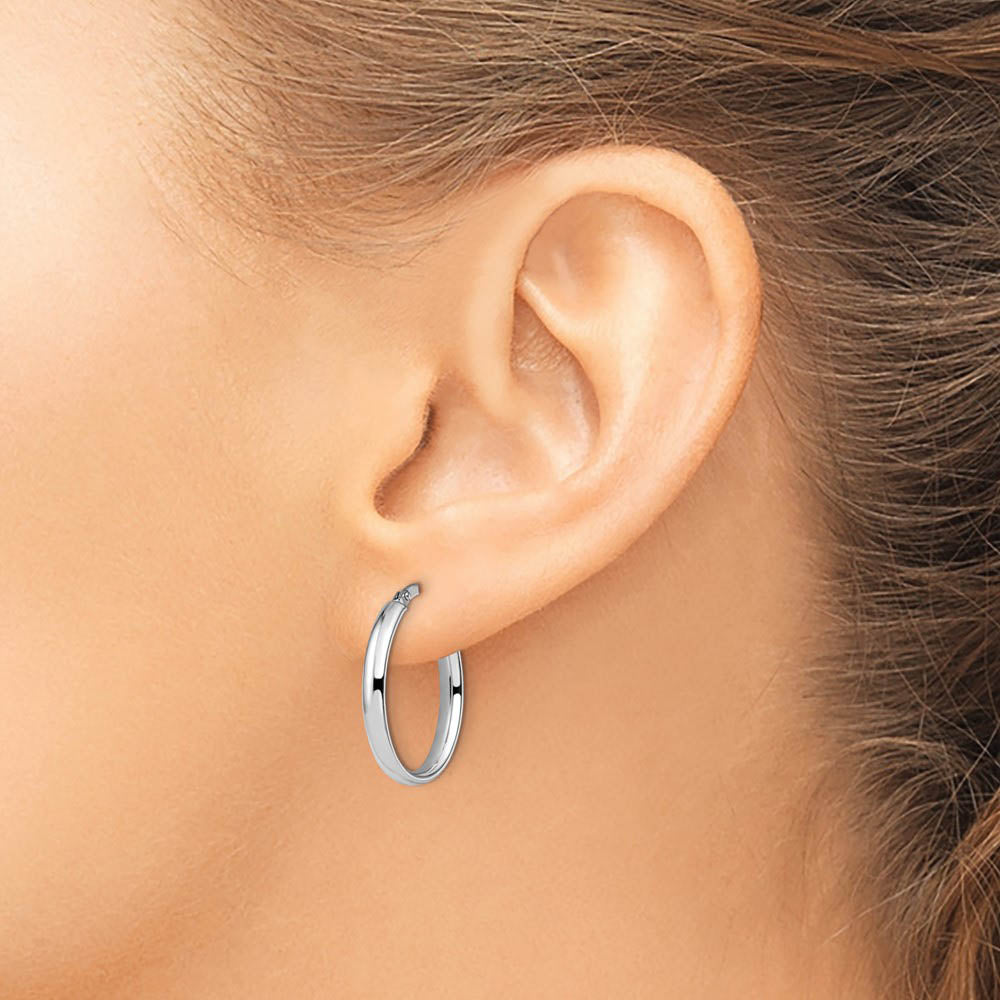 Alternate view of the 3mm x 22mm (7/8 Inch) Polished 14k White Gold Oval Tube Hoop Earrings by The Black Bow Jewelry Co.