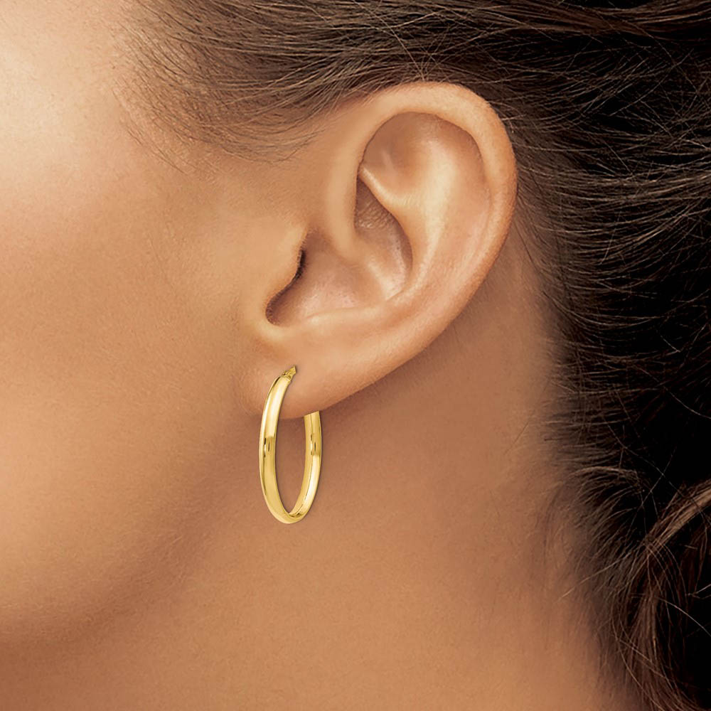 Alternate view of the 3mm x 26mm (1 Inch) Polished 14k Yellow Gold Oval Tube Hoop Earrings by The Black Bow Jewelry Co.