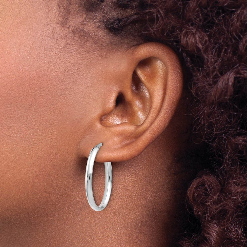 Alternate view of the 3mm x 26mm (1 Inch) Polished 14k White Gold Oval Tube Hoop Earrings by The Black Bow Jewelry Co.
