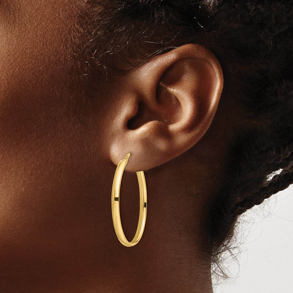 Alternate view of the 3mm x 33mm (1 5/16 Inch) Polished 14k Yellow Gold Oval Tube Hoops by The Black Bow Jewelry Co.