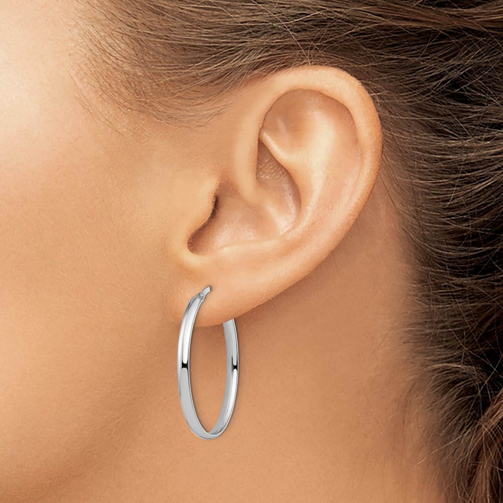 Alternate view of the 3mm x 33mm (1 5/16 Inch) Polished 14k White Gold Oval Tube Hoops by The Black Bow Jewelry Co.