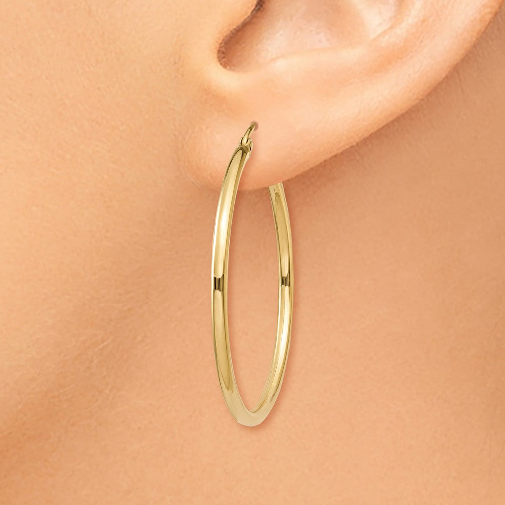 Alternate view of the 2mm, 14k Yellow Gold Classic Round Hoop Earrings, 35mm (1 3/8 Inch) by The Black Bow Jewelry Co.