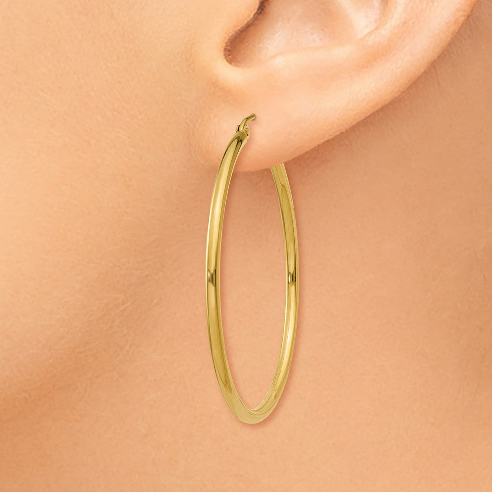 Alternate view of the 2mm, 14k Yellow Gold Classic Round Hoop Earrings, 40mm (1 1/2 Inch) by The Black Bow Jewelry Co.