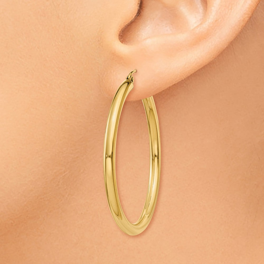 Alternate view of the 3mm, 14k Yellow Gold Classic Round Hoop Earrings, 40mm (1 1/2 Inch) by The Black Bow Jewelry Co.