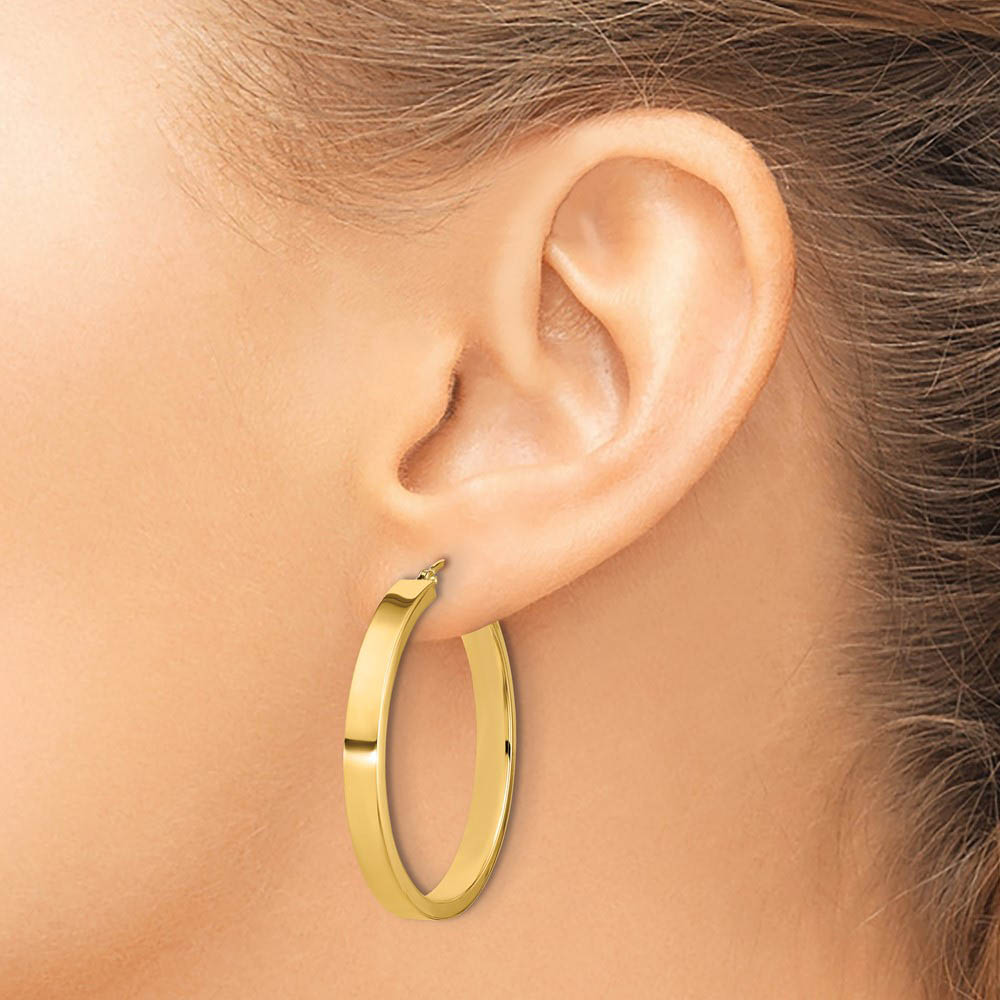 Alternate view of the 4mm, 14k Yellow Gold Polished Round Hoop Earrings, 35mm (1 3/8 Inch) by The Black Bow Jewelry Co.