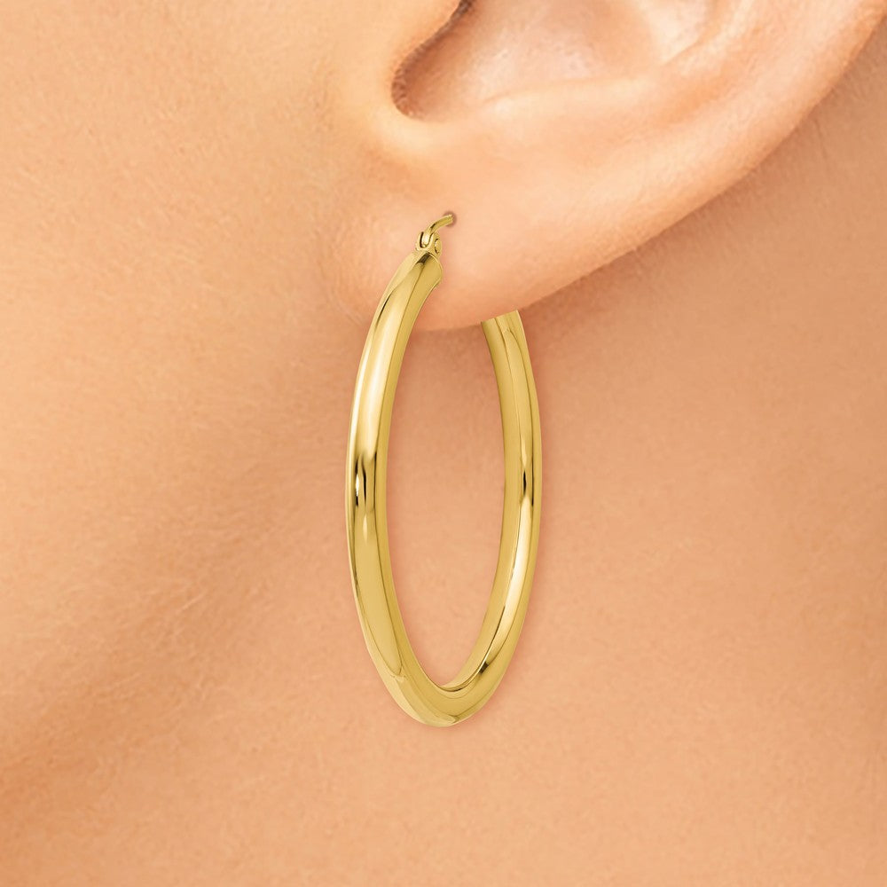 Alternate view of the 3mm Round Hoop Earrings in 14k Yellow Gold, 35mm (1 3/8 Inch) by The Black Bow Jewelry Co.